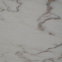Estremoz veined, marble honed finish.