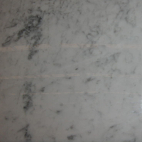 White Carrara marble, polished finish.