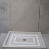 Solid shower tray in Fatima Blue limestone, honed finish.
