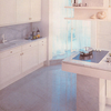 Kitchen cladding in white carrara marble, polished surface.
