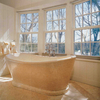 Bath tub in Sunny Light limestone, here shown in a matt finish