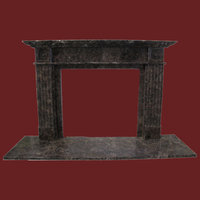 The Bullseye Fireplace out of Dark Emperador Marble, honed finish.