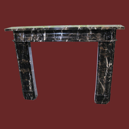 The Bullseye Fireplace out of Gold & Black Marble, polished.