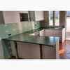 Kitchen worktops in black angola granite.